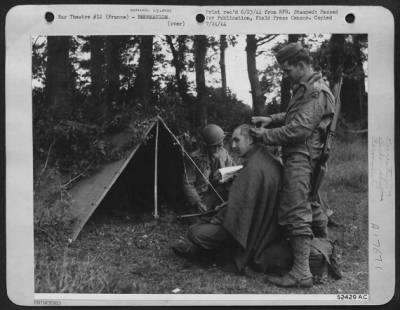 General > 9th Air Service Command soldiers, keeping supplies moving to landing strips right on the heels of the retreating Nazis, take time out for an improvised haircut. The "barber" (right) Pvt. Bernard De Martini of Brooklyn, N.Y., a former longshoreman, is