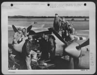 Thumbnail for First pictures of the Allied landings in France are being removed from Lockheed P-38 Lightning camera plane (F-5) after Lt. Col. C.A. Shoop returned from photo reconnaissance flight over the landing beaches on D-Day. - Page 1