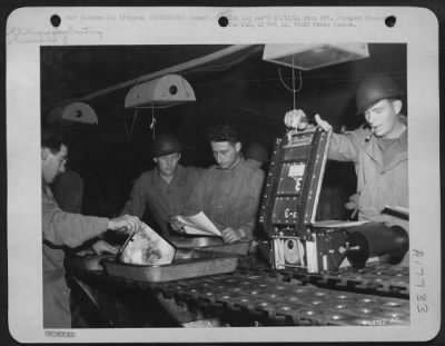 Processing > This is a section of the printing room of a Photo Recon Unit of the 9th AF. Left to right are: Cpl Ralph W. Libby, Banger, Maine; M/Sgt John H. Strobel, Louisville, Ky.; Cpl Marvin A. Darmstadter, Philadelphia, Penn.; and Sgt Louis P. Morse, Mobile