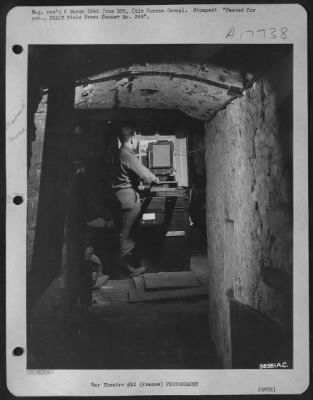 Processing > When a reconnaissance group of First Tact AF moved into this advanced air base the only available space for their photo laboratory was the dark wine cellar of an old French chateau. The technicians removed the cobwebbed bottles and casks (which