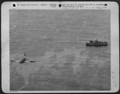 Thumbnail for General > A U.S. Army 8th Air Force Transport plane crashlands in the Ocean off the coast of France. One of the craft in the huge invasion fleet dashed up to rescue the crew. Note distinctive stripes on wings and fuselage which all Allied aircraft carried in