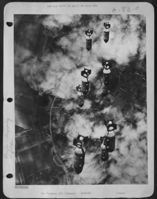 General > THUNDERING DOWN--Tons of bombs from AAF heavy bombers, attacking enemy airfields in central France 5 Feb 44, plummetting earthwards onto training bases for single engines fighter pilots near Tours. The heavy bombers were escorted throughout the