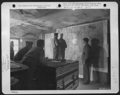 Thumbnail for General > In The Office Of A Former French Winery, Officers Study The Situation Map Maintained For This A-20 Havoc Unit, 416Th Bomb Group, 9Th Air Force, Operating From This Captured German Base.  Left To Right: 1St Lt. Lilburn S. Rogers, Scottville, Ky.; Capt. Rob