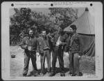 Thumbnail for Four Members Of The Crew Of A Consolidated B-24 Who Bailed Out After Their Plane Was Hit By Ack-Ack Talk Over Their Experiences At Omaha Beach, France Before Starting Back To England For A New Plane.  They Are, Left To Right: 1St Lt. Raymond Pascual Of Is - Page 1