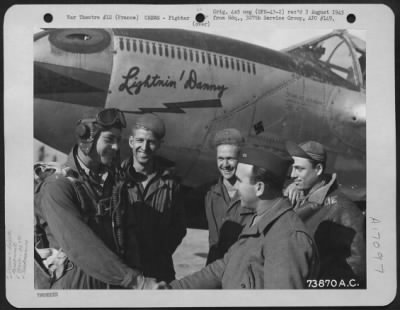 General > Standing Beside His Lockheed P-38 'Lightnin' Danny', At An Air Base Somewhere In France, Lt. Danny C. Heath Of The 367Th Fighter Group, Is Greeted By His Ground Crew After Just Returning From A Mission.  2 October 1944.