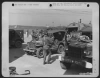 Quickly And Efficiently Members Of The 351St Fighter Squadron, 353Rd Fighter Group Load Their Necessary Equipment Onto Trucks And Jeeps Which Will Transfer Them To Their Planes On The Field All Ready To Participate In The D-Day Invasion On 6 June 1944.  E - Page 1