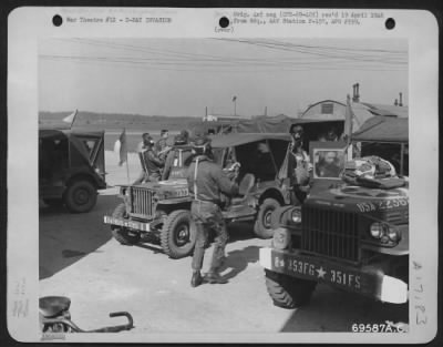 General > Quickly And Efficiently Members Of The 351St Fighter Squadron, 353Rd Fighter Group Load Their Necessary Equipment Onto Trucks And Jeeps Which Will Transfer Them To Their Planes On The Field All Ready To Participate In The D-Day Invasion On 6 June 1944.  E