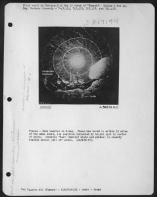 Radar > France - Same Beaches On D-Day.  Plane Has Moved To Within 35 Miles Of The Same Coast, Its Position Indicated By Bright Spots In Center Of Scope.  Invasion Fleet (Smaller Blobs And Grains) Is Clearly Visible Massed Just Off Shore.  (An/Aps-15).