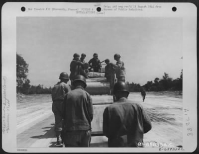 Thumbnail for Construction- Airfields > Just A Few Miles Behind The Front Lines In Normandy, France, Men Of The 9Th Air Force Aviation Engineers Constructed Emergency Landing Strips With "Hessian Mat" Used For Surfacing.  After The Selected Site For The Airstrip Is Graded And Leveled, The Mat,