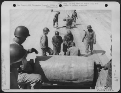 Thumbnail for Construction- Airfields > Just A Few Miles Behind The Front Lines In Normandy, France, Men Of The 9Th Air Force Aviation Engineers Constructed Emergency Landing Strips With "Hessian Mat" Used For Surfacing.  After The Selected Site For The Airstrip Is Graded And Leveled, The Mat,