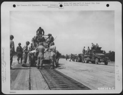 Thumbnail for Construction- Airfields > Just A Few Miles Behind The Front Lines In Normandy, France, Men Of The 9Th Air Force Aviation Engineers Constructed Emergency Landing Strips With "Hessian Mat" Used For Surfacing.  After The Selected Site For The Airstrip Is Graded And Leveled, The Mat,