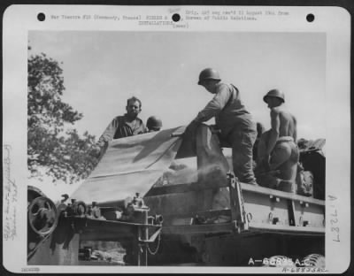 Thumbnail for Construction- Airfields > Just A Few Miles Behind The Front Lines In Normandy, France, Men Of The 9Th Air Force Aviation Engineers Constructed Emergency Landing Strips With 'Hessian Mat' Used For Surfacing.  After The Selected Site For The Airstrip Is Graded And Leveled, The Mat,