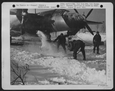 Thumbnail for Miscellaneous > All Personnel, Including Cooks, Clerks And Medics, Of A 9Th Air Force Martin B-26 Marauder Group Lend A Hand To Clear Snow Off Hardstands And Runways.  Note The First Aid Cross On Helmet Of Medic, Second From Left.  France.