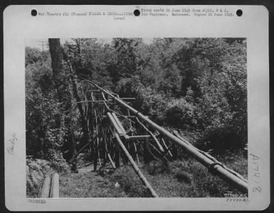 Thumbnail for Supplies > Trestle Bridges, Such As The One Shown Here, Are Built In Rough Country To Carry The Pipe Line Which Feeds Gas And Oil To The Front Line Troops In France.  July 29, 1944.