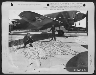 General > Men Of The 439Th Troop Carrier Group Arrange Tow Lines To Prevent Snags In Preparation For The Tow Planes And Gliders Which Later Took Part In What Was The Greatest Airborne Operation In The History Of The War, The Dropping Of Paratroops And Gliders Loade