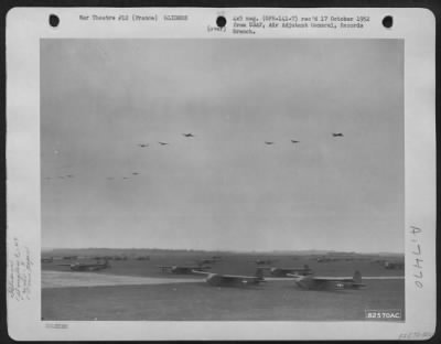 General > Douglas C-47S Towing Cg-4 Gliders Pass Over A 9Th Troop Carrier Command Base Somewhere In France.  12 March 1945.