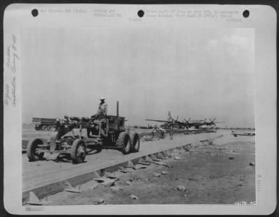 Consolidated > B-29 Base In India -- A Grader At Work On A Taxi Strip Which Is Being Constructed For The B-29 Superfortresses At A U.S. Army 20Th Bomber Command Base Somewhere In India.  Thousands Of Cubic Yards Of Concrete Were Used In Building Strips Thick Enough And