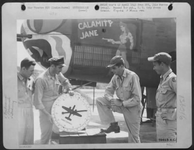 Consolidated > The Coming Monsoon Season In The India-Burma Theater, With All Its Flying Hazards, Doesn'T Worry These Eastern Air Command Pilots.  Under The Watchful Eye Of 'Calamity Jane', Capt. N.W. Ryder, 813 G. St., Rupert, Idaho, Explains The Essentials Of Aural Nu