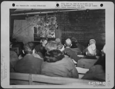 Consolidated > Lt. Colonel Edmundson, Santa Monica, California, Commanding Officer Of The 468Th Bomb Group, Briefing Pilots And Crew Before Bombing Mission To Mukden, Manchuria.