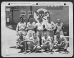 SOMEWHERE IN NORTH AFRICA: Nine original members of the "Doodle Bug" crew taken beside their Liberator. This crew went through months of intensive training as a team at Davis-Monthan Field, Tuscon, Ariz. They are, left to right (Front Row) - Page 1