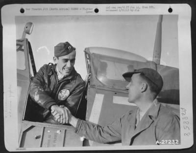 Consolidated > Two confirmed victories over Jerry in eight days brings that broad grin to the face of Capt. Harry L. Barr, Eldorado, Kan. He is a member of the 12th AF Air Support Command. Capt. Barr is being congratulated on his second victory by his crew chief