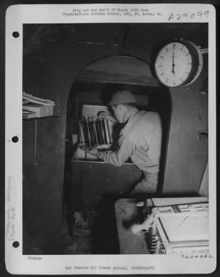 Thumbnail for Consolidated > An Air Force member develops film in a French Potez-54 "Flying Laboratory" at a 90th Photographic Reconnaissance Wing base somewhere in North Africa.