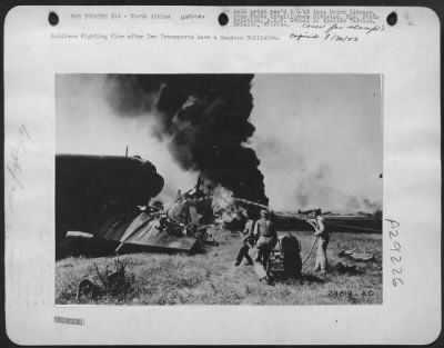 Consolidated > Soldiers Fighting Fire after Two Transports have a Head-on Collision.