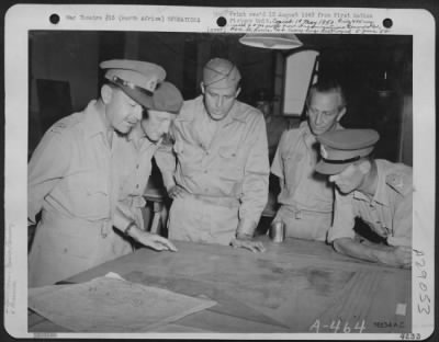 Consolidated > Somewhere In North Africa, High Ranking U.S. And English Officers Discuss Strategic Operations.  They Are, Left To Right:  General Sir Harold R.L.G. Alexander, Unidentified English Officer, Colonel Elliott Roosevelt, Group Capt. Humperies, Unidentified En