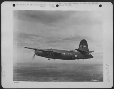 Thumbnail for Consolidated > Tunisia-Her left wing and engine nacelle riddled by flak, this Martin B-26 "Marauder" of the U.S. Army Air Forces flies home to a safe belly landing after a bombing raid in Tunisia.