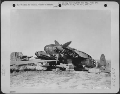 Consolidated > Tunis, Tunisia-Axis planes totaling over 250 were left by the enemy in their hasty retreat from El Aouina Airdrome during the battle of Tunisia. Many German aircraft were destroyed on the ground from the constant bombings from Allied planes. However