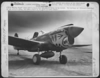 A P-40 'Flying Tiger' Plane Used In Major John Chennault'S Group On The Island.  The Markings Are Different From That Of His Father'S Group, Who Have A Shark On The Front Of Their Ships. - Page 1