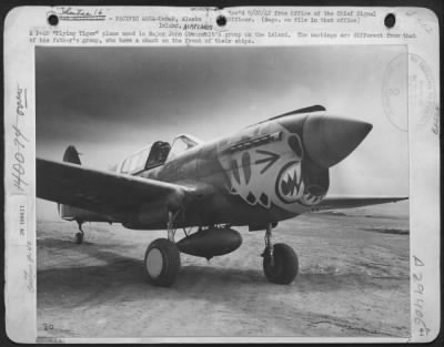 Consolidated > A P-40 'Flying Tiger' Plane Used In Major John Chennault'S Group On The Island.  The Markings Are Different From That Of His Father'S Group, Who Have A Shark On The Front Of Their Ships.