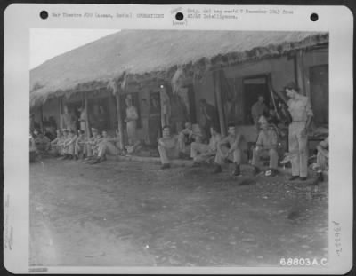 Thumbnail for Consolidated > On A Day In July 1943, Most Of The Pilots And Crews Relaxed As They Wait In Front Of The Air Transport Command Operations Building For Briefing, Prior To Flying A Mission Over The "Hump". Tezpur, Assam, India.