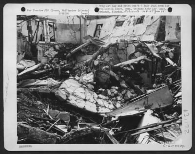 Consolidated > Bomb damage to a section of the Baguio General Hospital. This building was being was being used as Japanese Headquarters. Luzon Island, Philippine Islands. 20 July 1945.