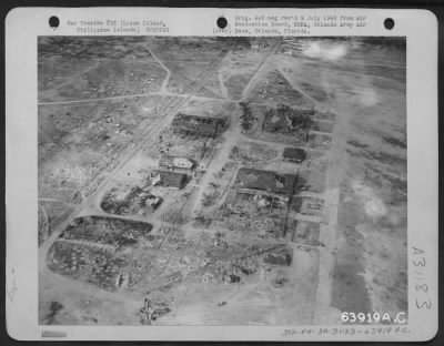 Consolidated > The hangars on Clark Field as seen from the air after bombing by U.S. Forces. Luzon Island, Philippine Islands, 1945.