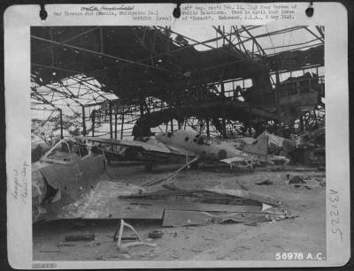 Consolidated > Manila, Philippine Islands-Here is what it looked like inside one of Clark Field's hangars after attacks by AAF bombers.