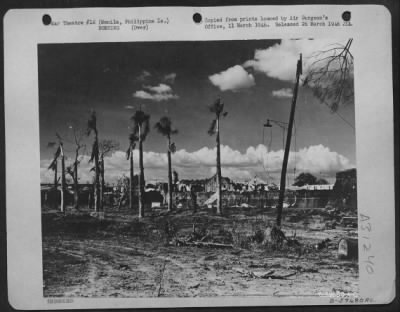 Consolidated > Bomb damage in Manila, Philippine Islands, Feb. 1945. Looking towards Intramuras from Manila Hotel.