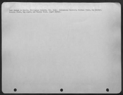 Consolidated > Bomb damage in Manila, Philippine Islands, Feb. 1945. Intramuras District; Neilson Field, top center; Nichols Field, top right; and Manila Hotel, right center.