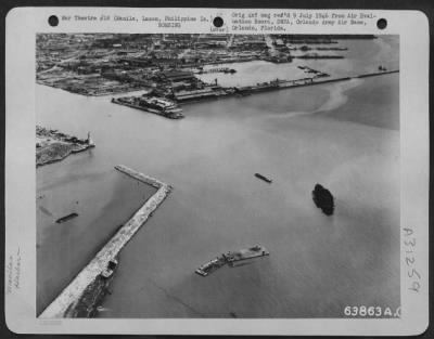 Thumbnail for Consolidated > The mouth of the Pasig River, Manila looking SE across Engineer Island. In the inner basin can be seen a coastal passenger cargo ship, 500 G.T. (gross tonnage) two landing stages: a barge and one launch are visible in the bottom half of the