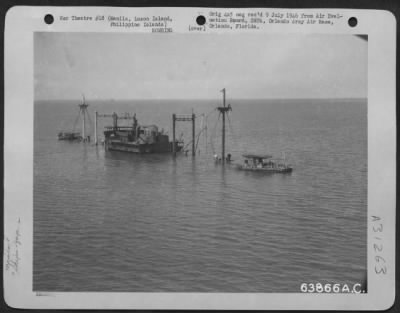 Thumbnail for Consolidated > Manila Harbor. A modern 7100 (gross Tonnage) freighter transport, Nagara Maru class. February 1945.