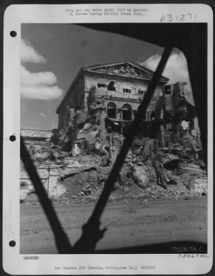 Consolidated > Bomb damaged buildings on Manila, Philippine Islands. 22 April 1945.