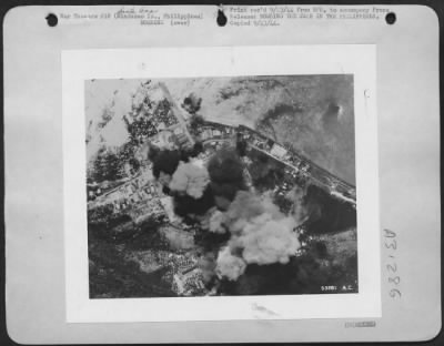 Consolidated > BOMBING THE JAPS IN THE PHILIPPINES-At Santa Ana, near Davao. Installations are bombed by the 5th Air Force unit of the Far Eastern Air Force. This is on Mindanao, southernmost island of the Philippines.