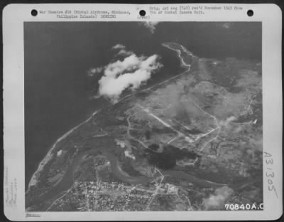 Consolidated > Bombs, dropped by Consolidated B-24's of the 494th Bomb Group, burst on Mintal Airdrome located a few miles west of the city of Davao on Mindanao in the Philippine Islands. March 1945.