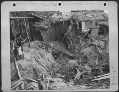 Consolidated > Homes of thousands of Filipinos were demolished when Japanese artillery and air raids rained down destruction on them. Houses above are of bamboo construction and were easy targets for the enemy, as is seen by this 13th AAF photo. Tocloban, Leyte