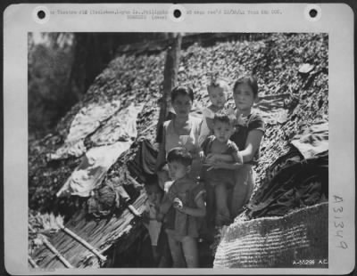 Consolidated > Bombed out by Japanese bombs and shells, this Filipino family from Tacloban, Leyte, Is., P.I. Grp is ready to start all over again with the help of the Americans.