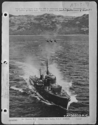 Consolidated > DISASTER FOR JAP CONVOY AT ORMOC BAY--A B-25 of the Far East Air Forces 38th Bomb Group roars in over a Japanese destroyer in Ormoc Bay Leyte, P.I. For what happened to this destroyer, see B-56859.