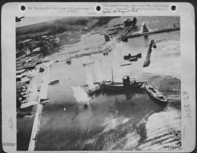 Consolidated > While bombs were still bursting the 5th AF "Sun Setters" come in low on a strafing run at Zamboanga, Mindanao, in the Philippines. Zamboanga was one of the Jap-held ports pounded to prevent their being used for sending troops or supplies to Leyte.