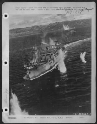 Consolidated > DISASTER FOR JAP CONVOY AT ORMOC BAY--This Japanese vessel, carrying a deck load of material and ducking Japs, is the target of bombs from B-25s of the Far East Air Forces which are attacking a Jap convoy trying to reinforce the big base at Ormoc
