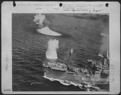 Consolidated > DISASTER FOR JAP CONVOY AT ORMOC BAY--This Japanese vessel is in serious trouble with bomb bursts geysering near it. It is part of a convoy trying to reinforce the big base at Ormoc, Leyte, P.I., but now in Ormoc Bay, is under attack by B-25s, P-38s