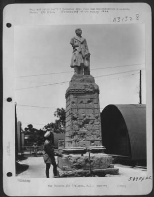 Consolidated > Bomb damaged statue at Palawan, Philippine Islands. 8 July 1945.